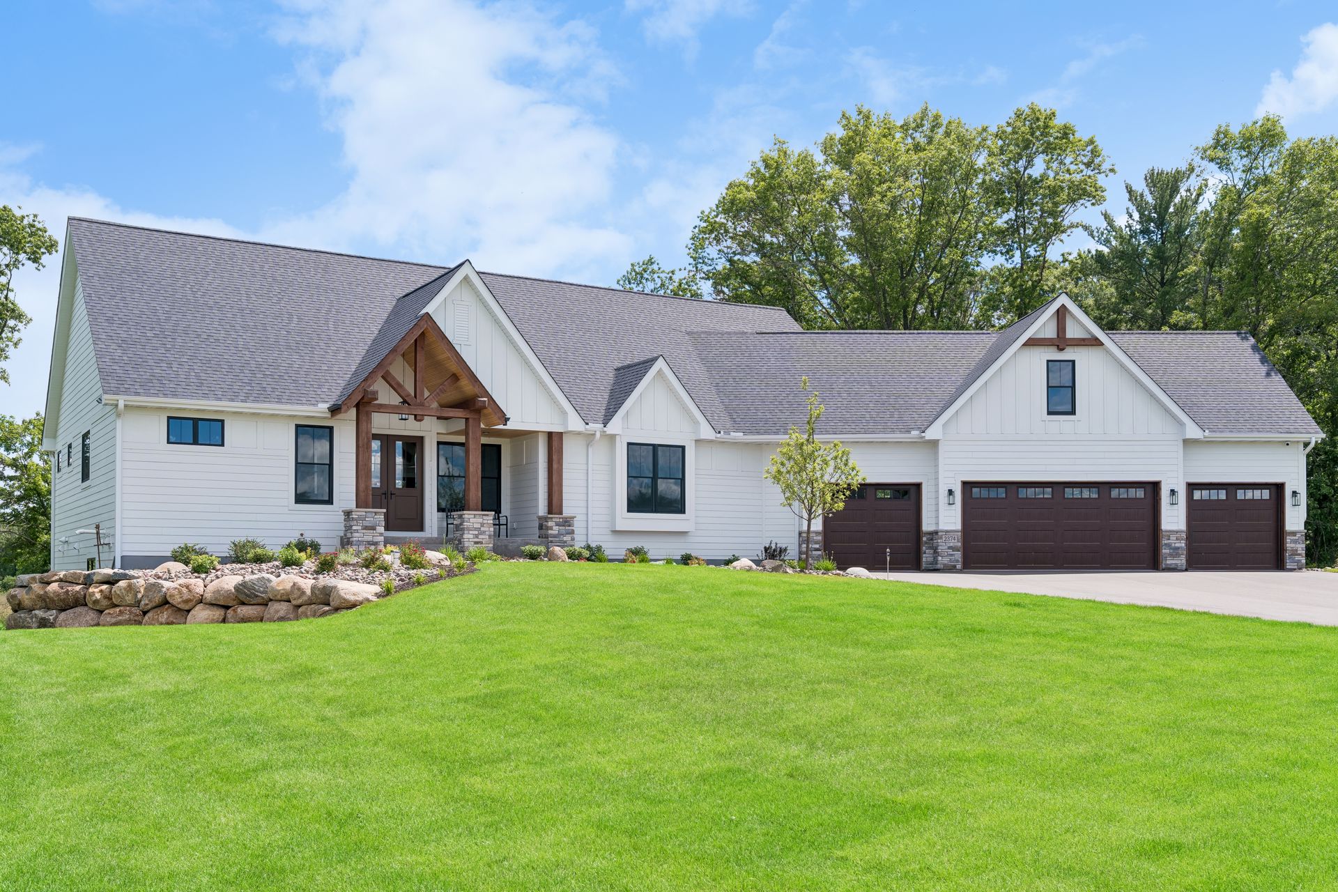 Front elevation of custom luxury rambler home at Swedish Chapel Estates